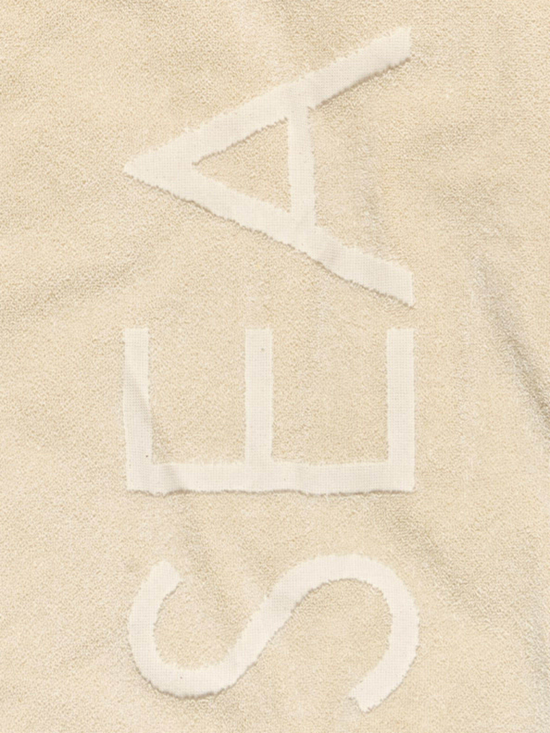Frottiertuch Undyed Logo Einweben Baumwolle Feinzwirn Detail