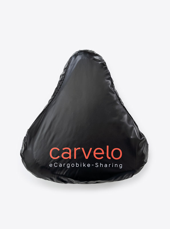 Velo Sattelueberzug Carvelo Mit Logo Bedrucken Pvc Recycled Schuetzt Vor Regen Schnee Werbetraeger
